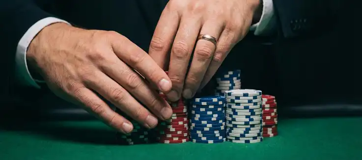 man with stacks of chips 