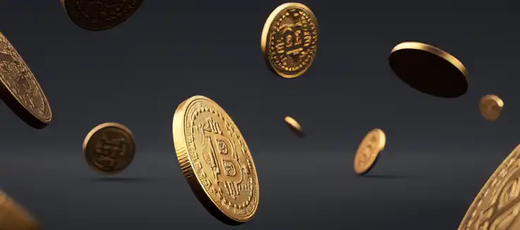 golden bitcoins falling through the air