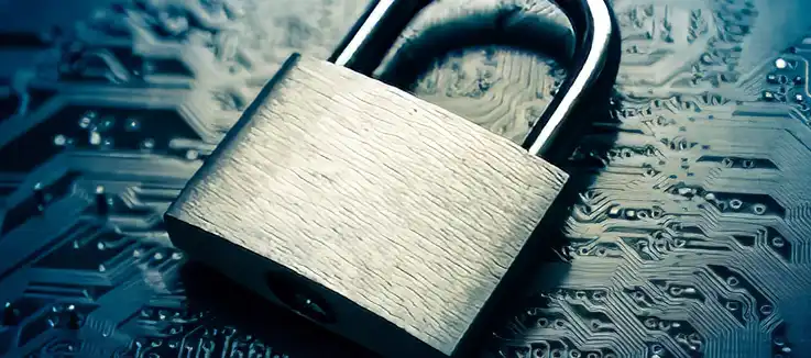 a computer circuit board with a padlock sitting on it