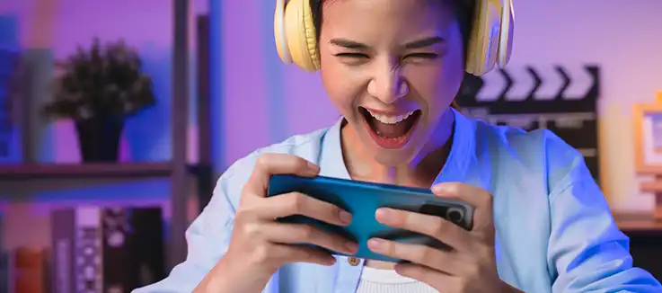 woman playing games on her mobile